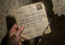 My mother died at 89. Renovating her bedroom, I found a letter behind the wallpaper. Sealed. Addressed to me. Dated 41 years ago. “If you’re reading this, I’m gone. When you were 6 weeks old, a woman came to our door. Crying. She begged me to take you. Your father was dangerous. ” My hands trembled. “She visits every birthday. Sits in a car across the street.” My birthday was 3 days ago. I checked the Ring footage. A blue Honda. Parked for 2 hours. I checked past years. Same car. Every birthday. Last year, a $180 gold bracelet appeared on the porch. No card. I walked outside. The Honda was there. The woman looked up. She had my eyes. She whispered, “I’m your … ‘